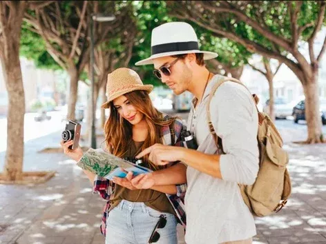 In which countries do tourists outnumber the local population?